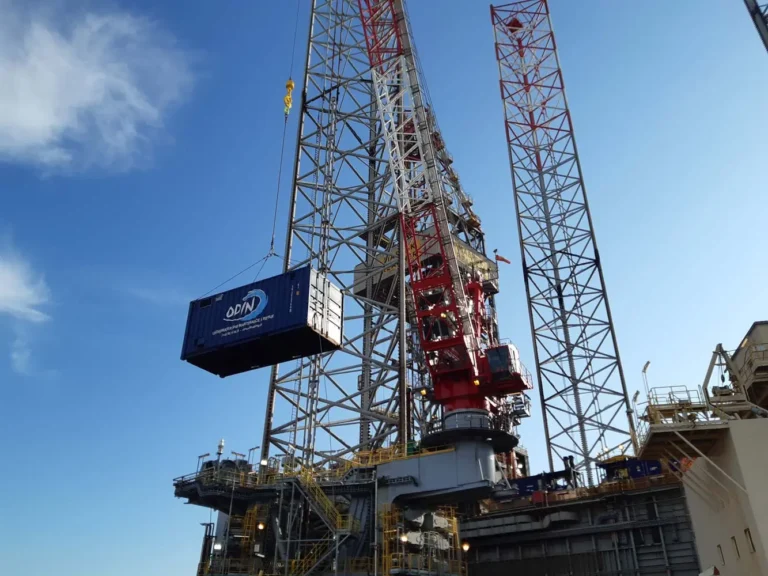 Container getting lifted by a crane
